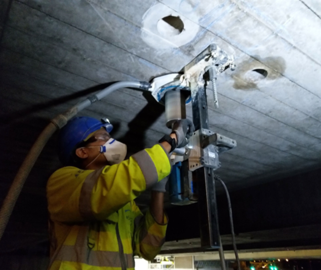 Wet coring upside down under a bridge